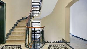 A spiral staircase with marble steps and a metal railing, leading to an upper floor. - Lepetit 3 Welcomely - Two Bedroom Apartment, Sleeps 5 (Milan)