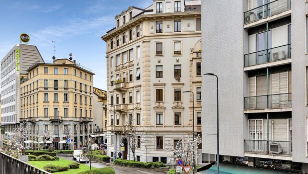 A hotel with a classic European architectural style, featuring multiple stories, balconies, and a well-maintained garden area. - Lepetit 3 Welcomely - Two Bedroom Apartment, Sleeps 5 (Milan)