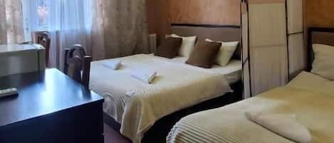 Superior Triple Room | Minibar, individually decorated, individually furnished, desk