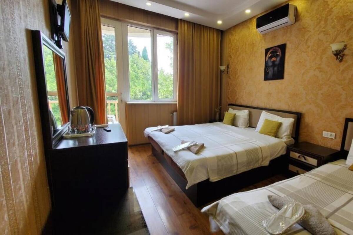 Superior Triple Room | Minibar, desk, laptop workspace, soundproofing