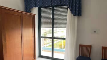 Family Quadruple Room, Balcony | In-room safe, desk, laptop workspace, blackout curtains