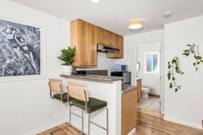 Fridge, microwave, stovetop, coffee/tea maker
