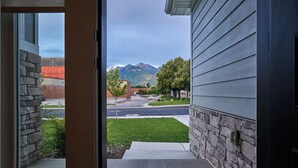 A view from a doorway to a street with a mountain in the background. - 3 Bedroom, 4 bed/3 Bath, Close to Mountains, Downtown and Airport (Midvale)