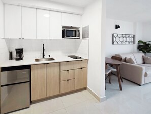Fridge, microwave, stovetop, coffee/tea maker