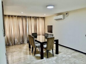 Classic Apartment, Balcony, City View | Dining room