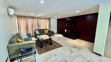 Classic Apartment, Balcony, City View | Living area | Flat-screen TV, DVD player