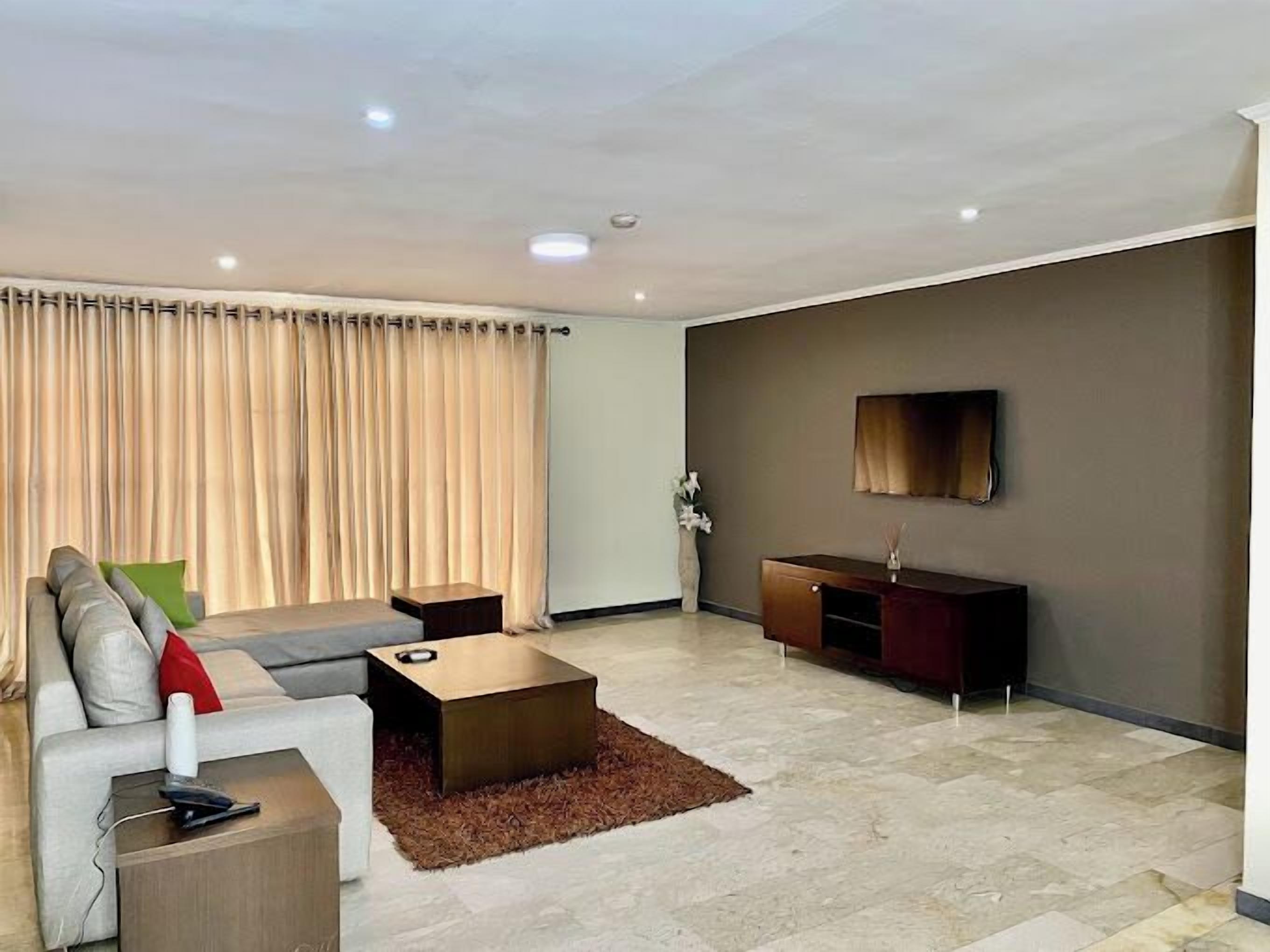 Classic Apartment, Balcony, City View | Living area | Flat-screen TV, DVD player