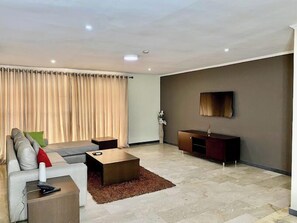 Classic Apartment, Balcony, City View | Living area | Flat-screen TV, DVD player