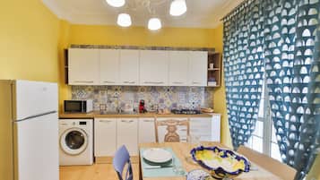 Deluxe Apartment, Balcony | Private kitchen | Full-sized fridge, microwave, oven, stovetop