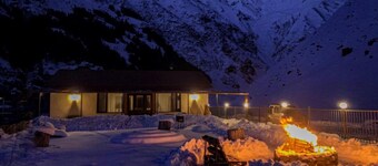 A Private Guest House in a secluded area by the river, surrounded by mountains.