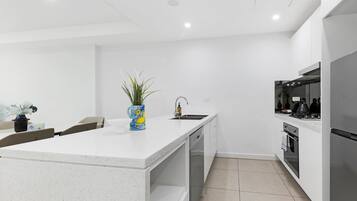 Design Apartment, 2 Bedrooms (NMA260-612) | Private kitchen | Oven, stovetop, cookware/dishes/utensils, dining tables