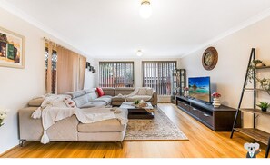 House (NWH023) | Living area - Kozyguru | West Hoxton | Spacious 7-Person Home With Backyard (West Hoxton)