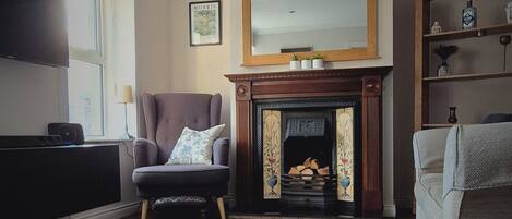 Smart TV, fireplace, books