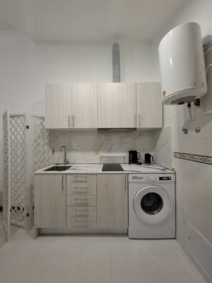 Fridge, microwave, stovetop, coffee/tea maker