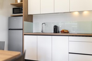 Fridge, microwave, stovetop, coffee/tea maker