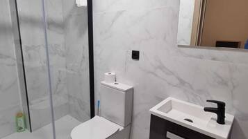 Shower, towels, soap, toilet paper