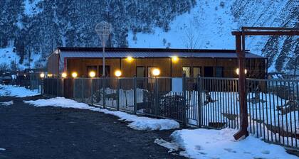 A studio apartment at a secluded area by the river, surrounded by mountains.