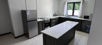 Cozy 2 bed-room house with beautiful front yard; 15 minutes to the beach.