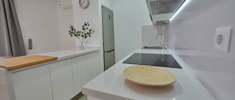 Fridge, microwave, stovetop, coffee/tea maker