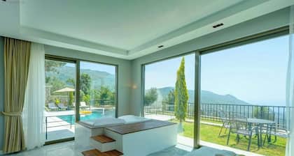 Luxury sea view hillside villa with a pool, indoor jacuzzi.