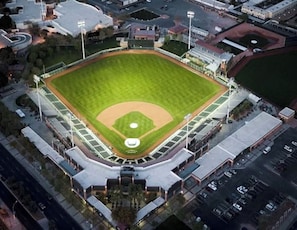 An aerial view of a baseball stadium with a central diamond, surrounding seating areas, and a parking lot. - Escape in the Heart of Old Town Scottsdale AZ (Scottsdale)
