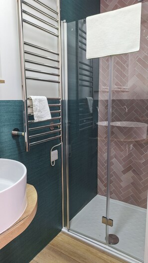 Shower, eco-friendly toiletries, hair dryer, towels