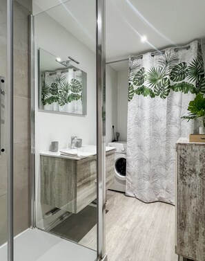 Shower, hair dryer, towels, soap