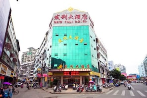 A hotel with a prominent sign in both English and Chinese, indicating it is a New Fai Hotel. - New Fali Hotel (Lianjiang)