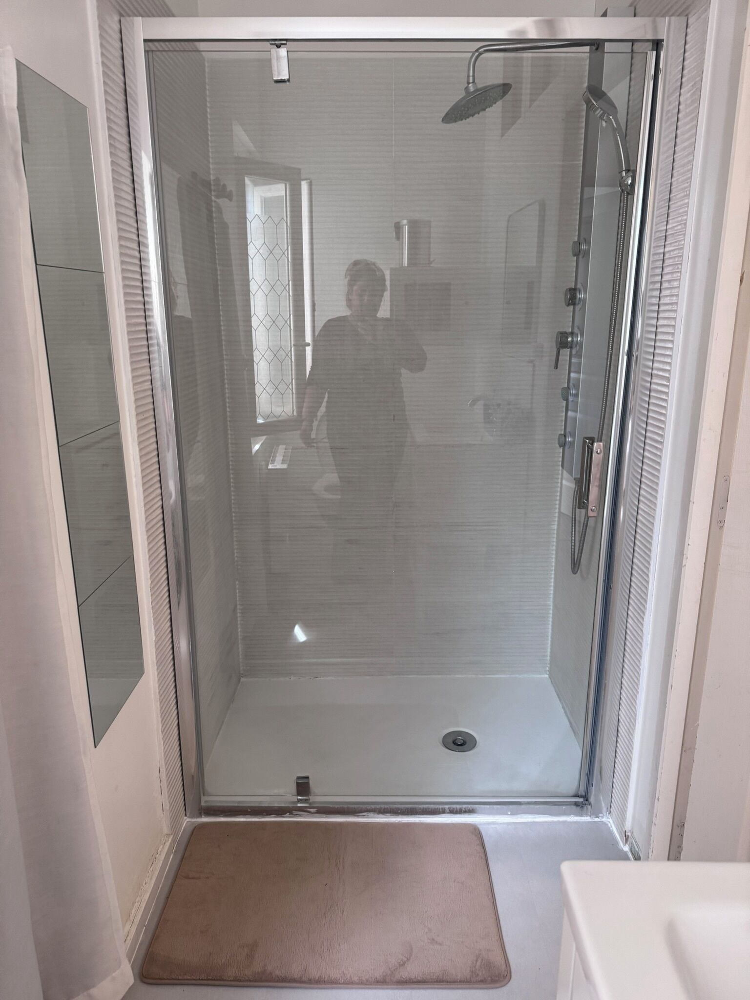 Shower, hair dryer, towels, toilet paper