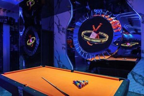 A pool table with balls, a clock, and a neon sign. - Qingcheng Hotel (Qinghe)