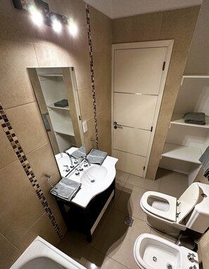 Hair dryer, bidet, towels, soap