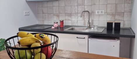 Fridge, microwave, stovetop, coffee/tea maker