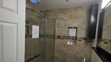 Shower, hair dryer, towels, soap