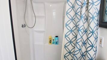 Shower, hair dryer, towels, toilet paper