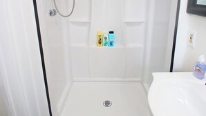 A bathroom with a shower, a sink, and a toilet. - Updated studio 7 minute walk to beach.  FREE Park! (Old Orchard Beach)
