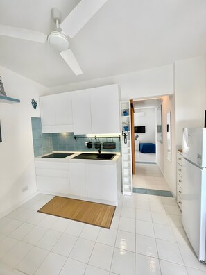 Fridge, microwave, stovetop, coffee/tea maker