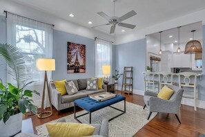 Smart TV, fireplace, books, computer monitors