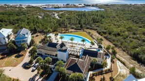 An aerial view of a resort with a swimming pool, beachfront property, and multiple buildings. - ☀️Infinity Pool-4BR-30A Cypress Stay (Santa Rosa Beach)