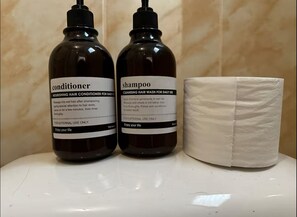 Shower, towels, soap, toilet paper