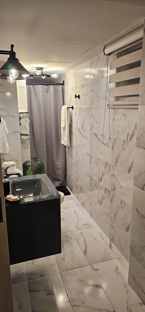 Shower, towels, soap, shampoo