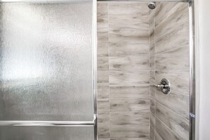 Shower, towels, soap, toilet paper