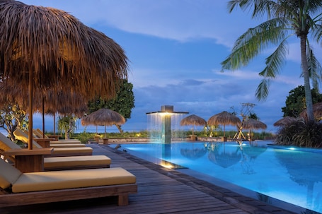 Outdoor pool, open 6:00 AM to 9:00 PM, pool umbrellas