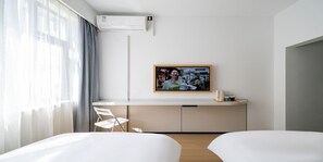 Basic Twin Room | Living area | TV - Baolong Homelike Hotel Zhongshan Branch (Shanghai)