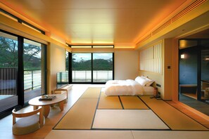 A modern hotel room with tatami mats, a bed, a small table, and a TV. - HARUNOYA (Hangzhou)
