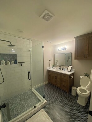 Shower, hair dryer, towels, soap