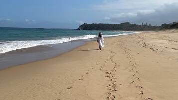 Walking along the shoreline, guests can enjoy the tranquil atmosphere and breathtaking views of the calm sea.