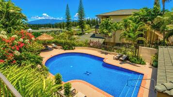 The sparkling pool at Kapalua Golf Villas offers a refreshing oasis surrounded by tropical palms. It is the perfect spot to cool off and unwind after a day of island adventures.