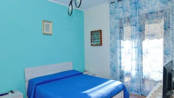 Comfort Apartment, Balcony, Partial Sea View | 2 bedrooms, down duvets, blackout curtains, iron/ironing board