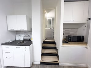 Fridge, microwave, stovetop, coffee/tea maker