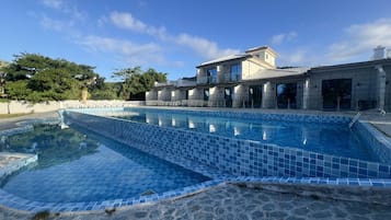 Outdoor pool, open 8:00 AM to 8:00 PM, pool umbrellas, pool loungers
